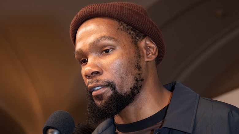 Kevin Durant wearing a beanie, speaking