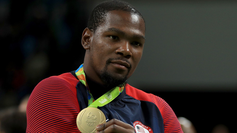 Kevin Durant holding a gold medal