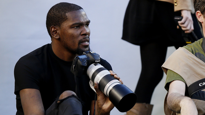 Kevin Durant holding a camera