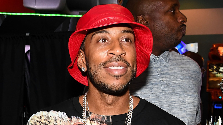 Ludacris in a red bucket hat