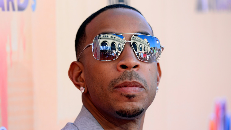 Ludacris wearing reflective sunglasses