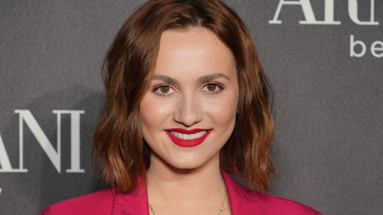 Maude Apatow, wearing a bold lip, smiling