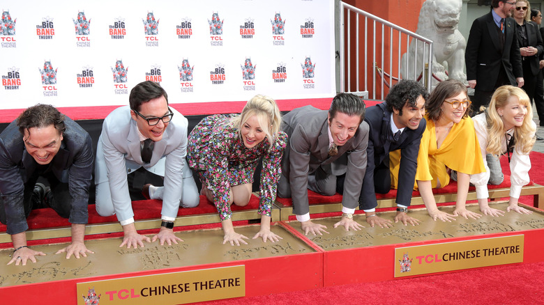 Cast of The Big Bang Theory at TLC Theatre, pressing palms down