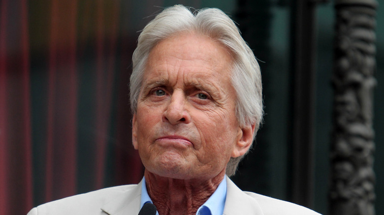 Michael Douglas in front of a mic