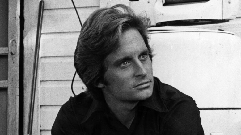 Michael Douglas sitting on steps