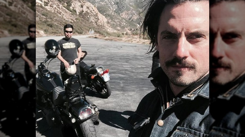 Milo Ventimiglia taking a selfie on motorcycle trip