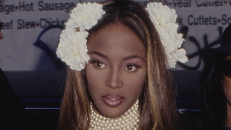 Naomi Campbell with flowers on her head