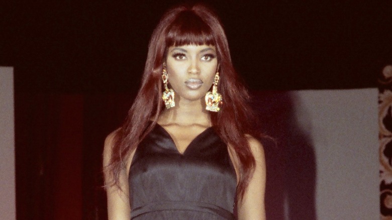 Young Naomi posing on the runway