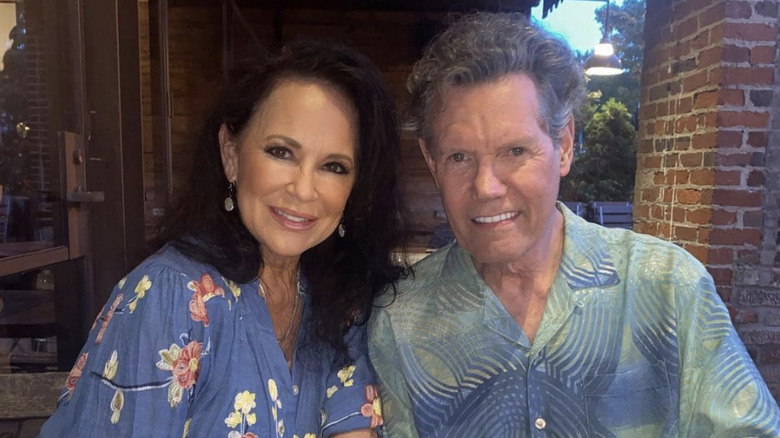 Mary Travis and Randy Travis smiling