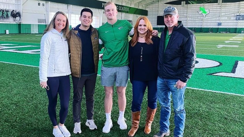 Bryce Drummond with his family on the football field