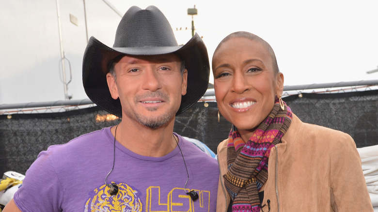 Tim McGraw and Robin Roberts, both smiling