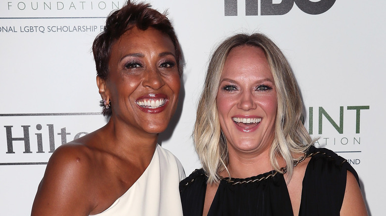 Robin Roberts and Amber Laign smiling on the red carpet