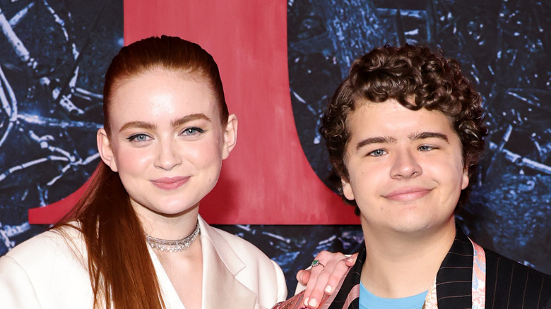 Sadie Sink and Gaten Matarazzo smile