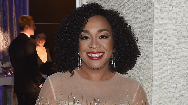 Shonda Rhimes wearing silver earrings