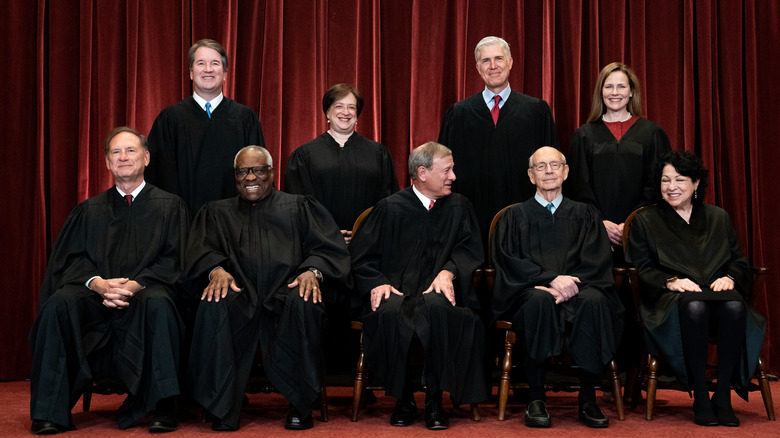 The Supreme Court in a group photo, all smiling