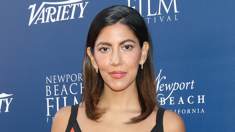 Stephanie Beatriz with a slightly serious expression