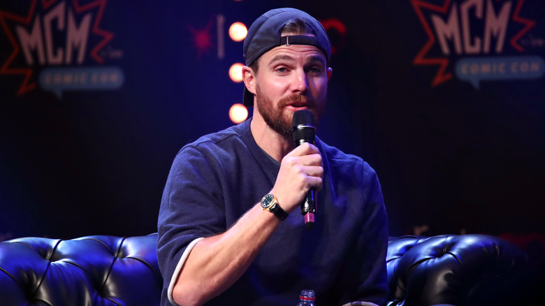 Stephen Amell speaking onstage