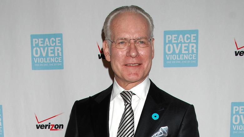 Tim Gunn smiling and looking to the side on the red carpet