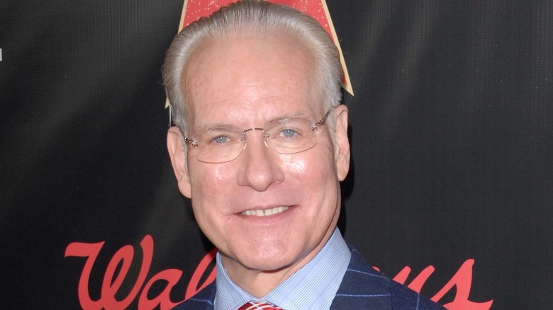 Tim Gunn smiling and looking at camera