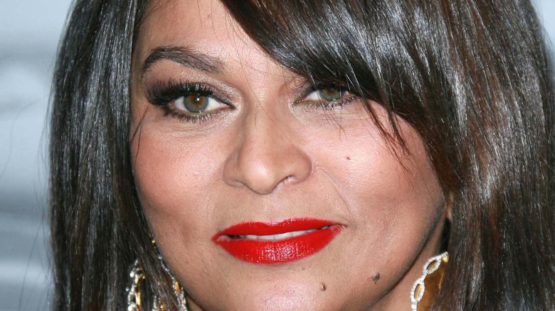 Tina knowles stares at camera