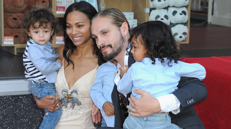 Zoe Saldaña poses with husband and children