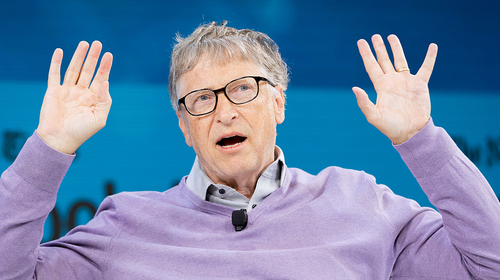 Bill Gates with his arms up
