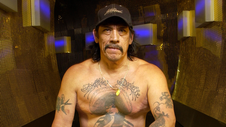 Danny Trejo shirtless and tattooed