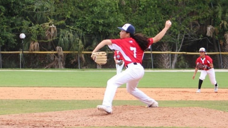 Olivia Pichardo playing baseball