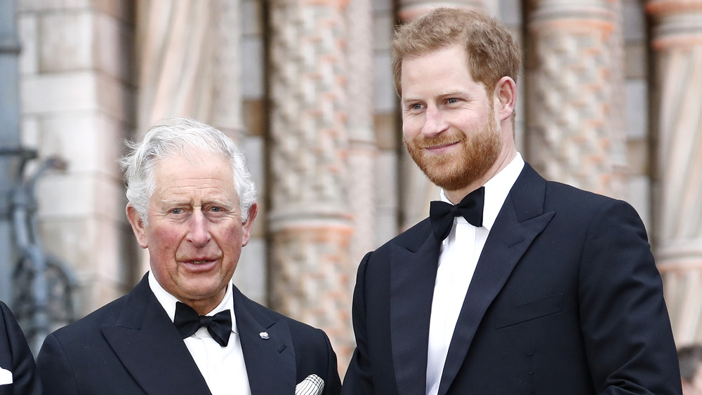 Prince Charles and Prince Harry smiling in tuxedos 