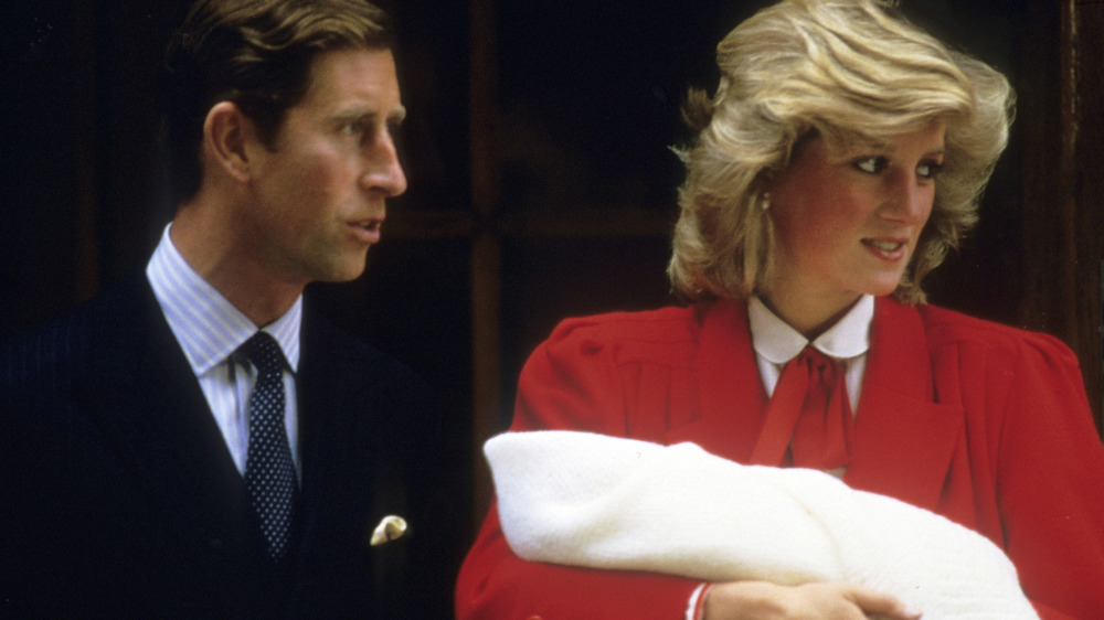 Prince Charles and Princess Diana leaving the hospital with infant Prince Harry 