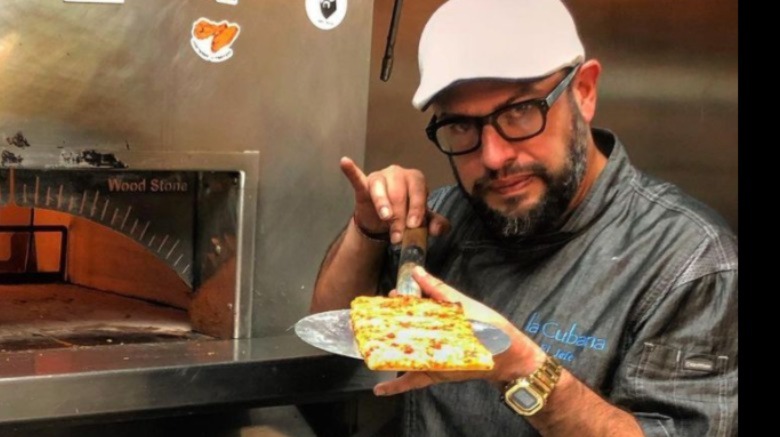 Carl Ruiz posing with food