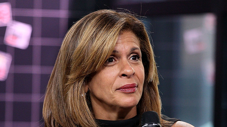 Hoda Kotb holding microphone