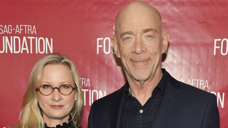 J. K. Simmons and Michelle Schumacher, both posing