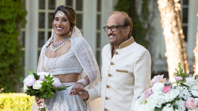 Deepti and dad at her wedding, walking down aisle