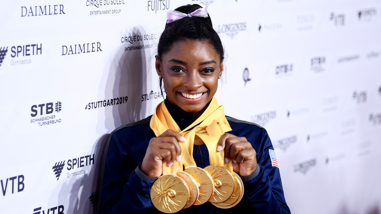 Simone Biles with gold medals