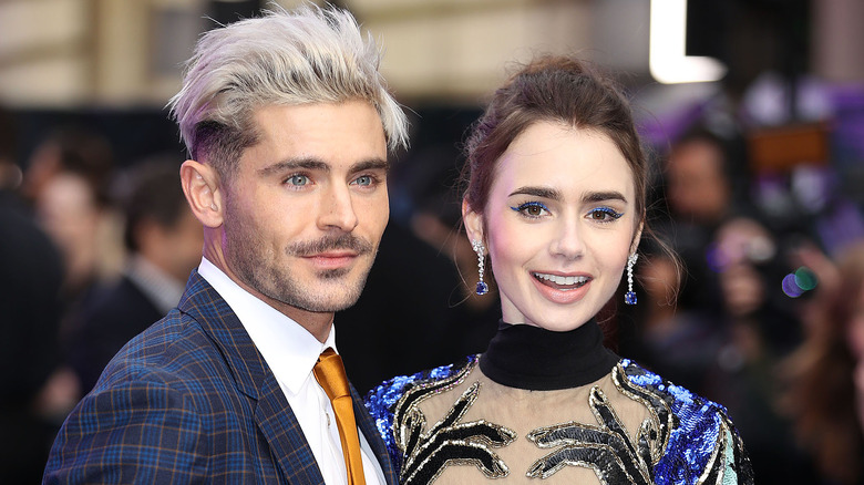 Zac Efron, Lily Collins posing