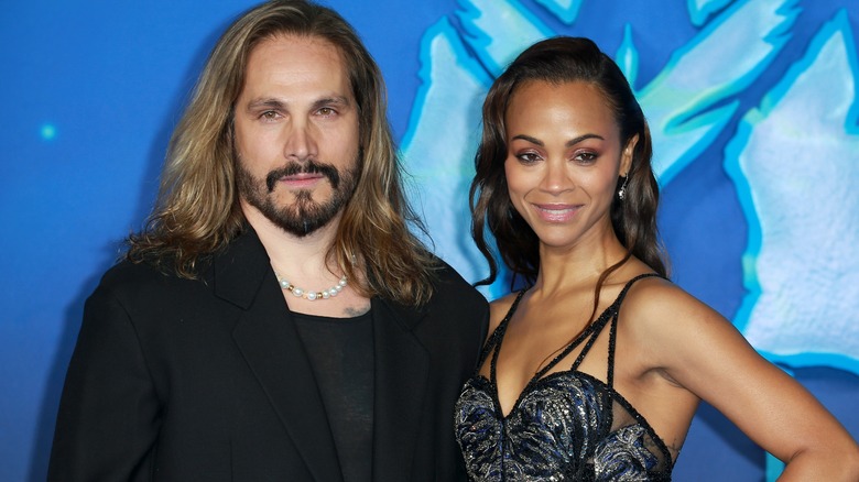 Marco Perego and Zoe Saldana posing