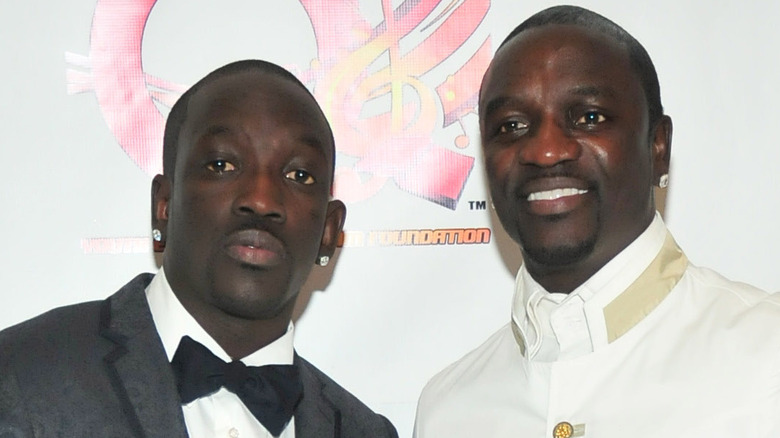 Abou Thiam and Akon posing