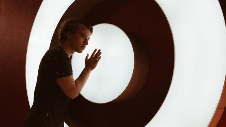 Alex in front of large Target logo