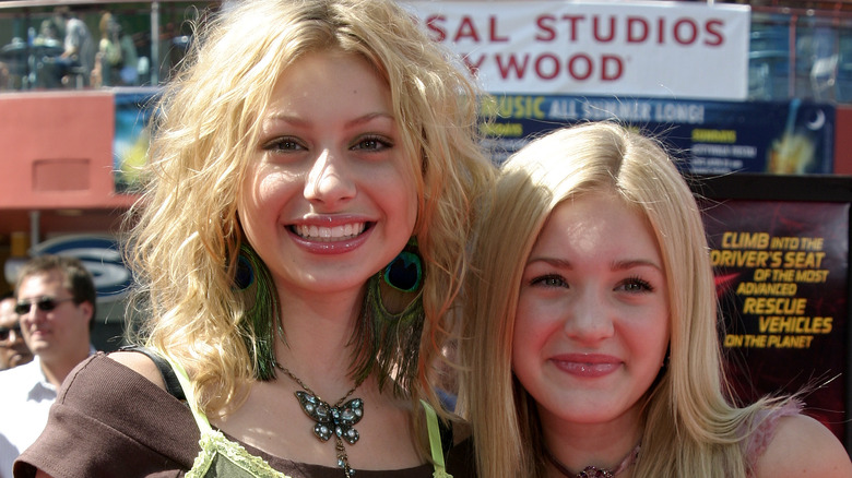 Young Aly and AJ Michalka smiling at camera