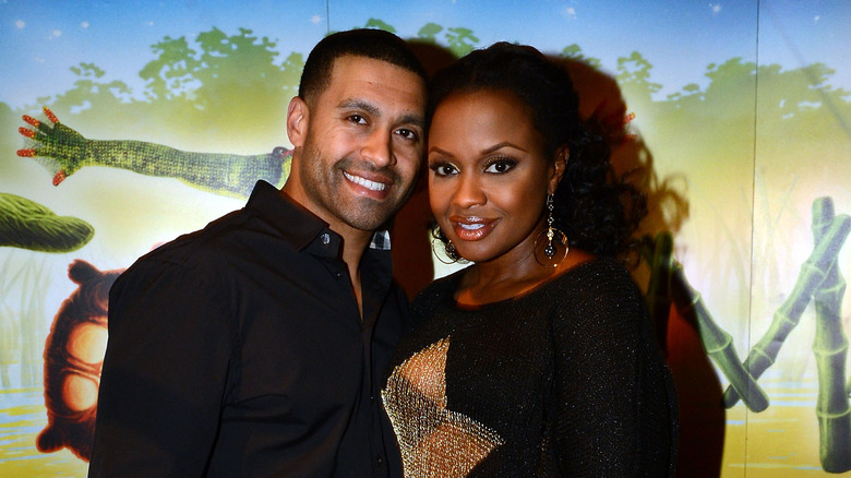 Apollo Nida and Phaedra Parks posing