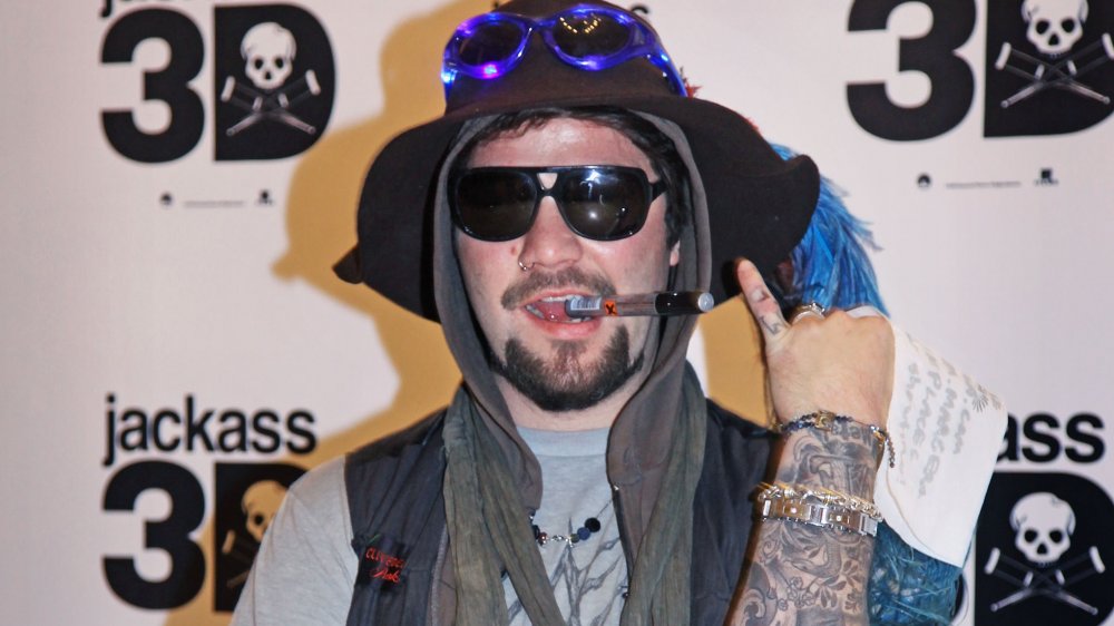 Bam Margera posing in sunglasses and hat