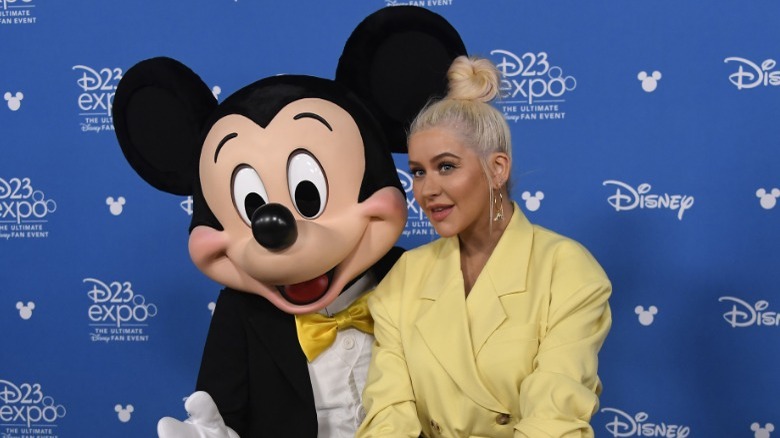 Mickey Mouse and Christina Aguilera posing