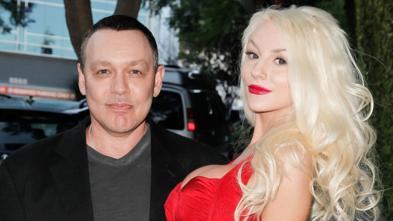 Doug Hutchison and Courtney Stodden posing together outdoors.