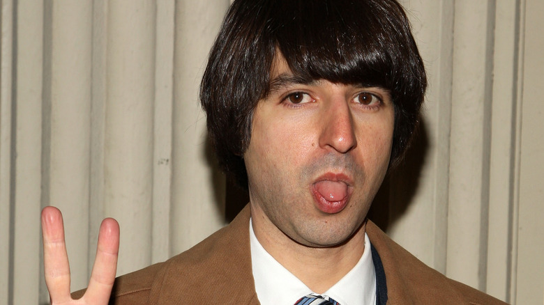 Demetri Martin sticking his tongue out