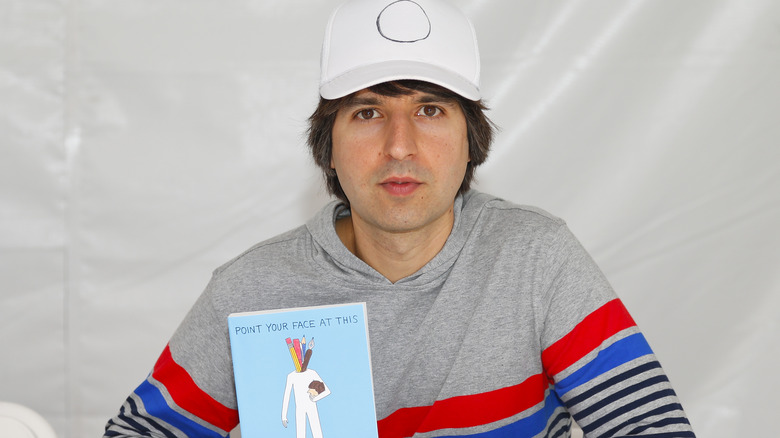 Demetri Martin with his book