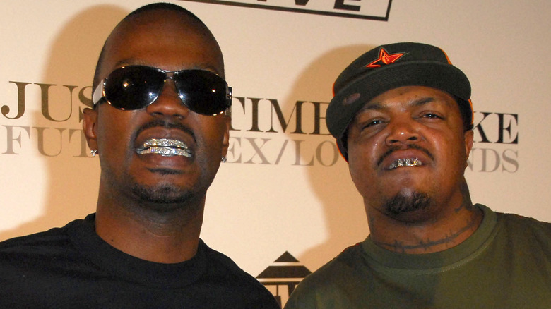 Juicy J and DJ Paul showing their diamond teeth