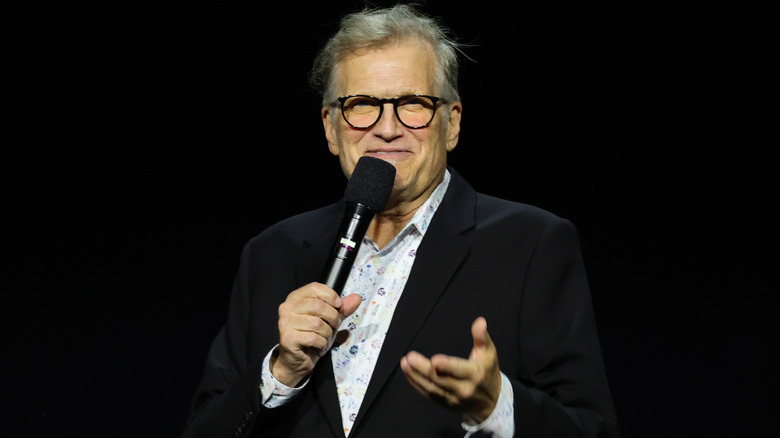 Drew Carey speaking on stage.