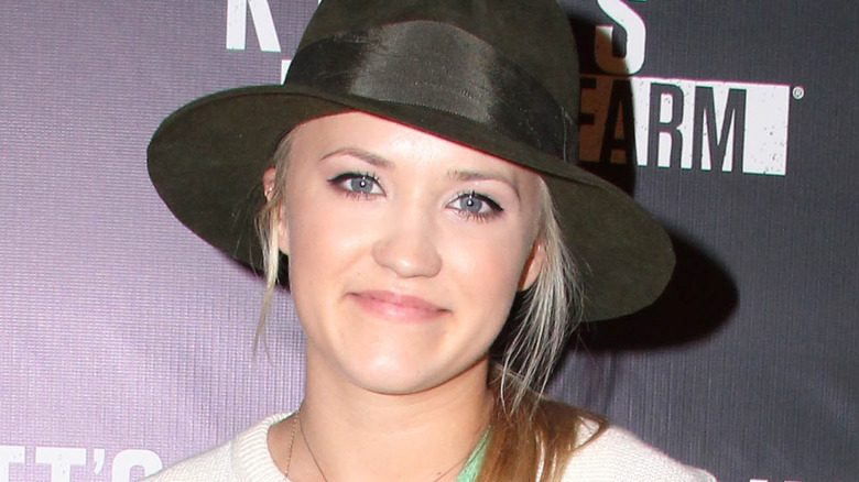 Emily Osment looks at camera