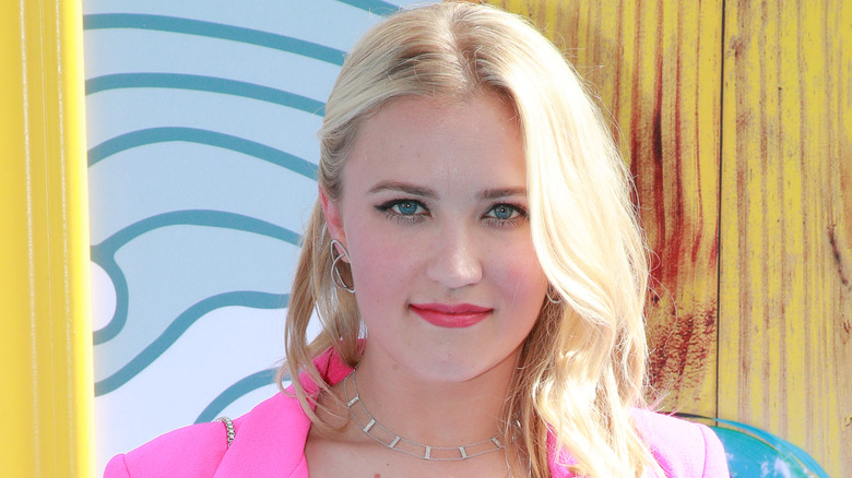 Emily Osment looks at camera